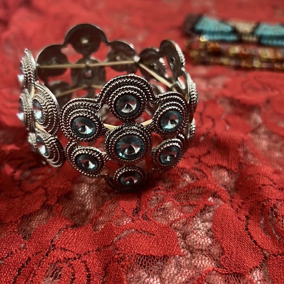 Two bracelets. One is stretch, Blue and silver and one has a clasp, tan and gold - Picture 6 of 7